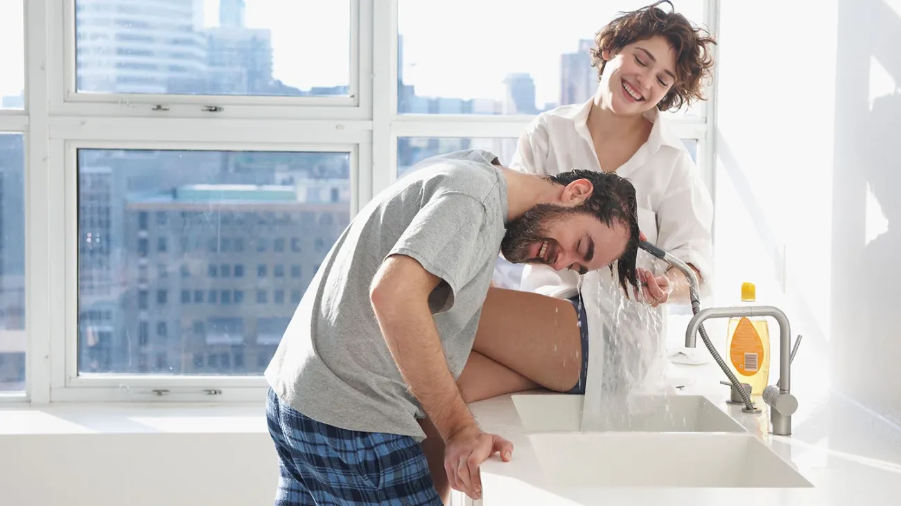 woman and man have fun washing hair